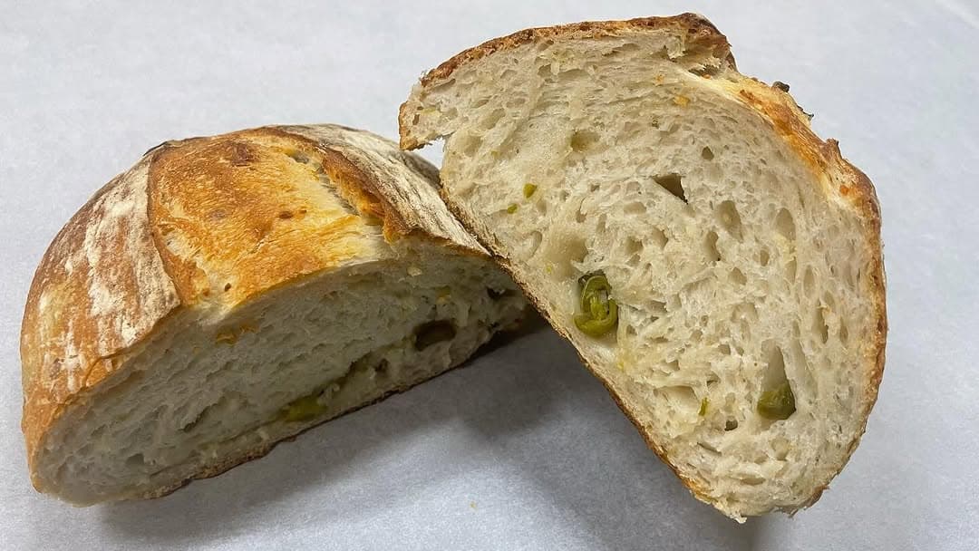 Jalapeño and cheese sourdough sliced to show the crumb